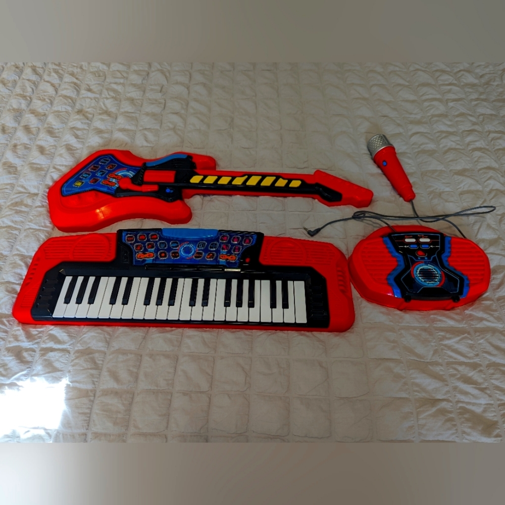 Kids keyboard/microphone/electric guitar set.